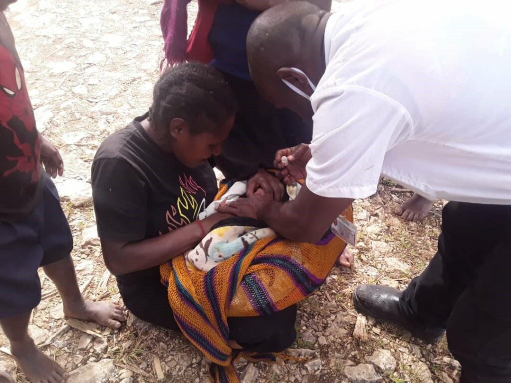 child being administered vaccine