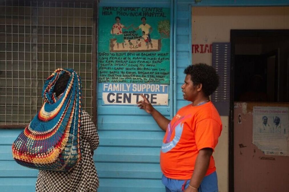 two women standing outside a family support centre