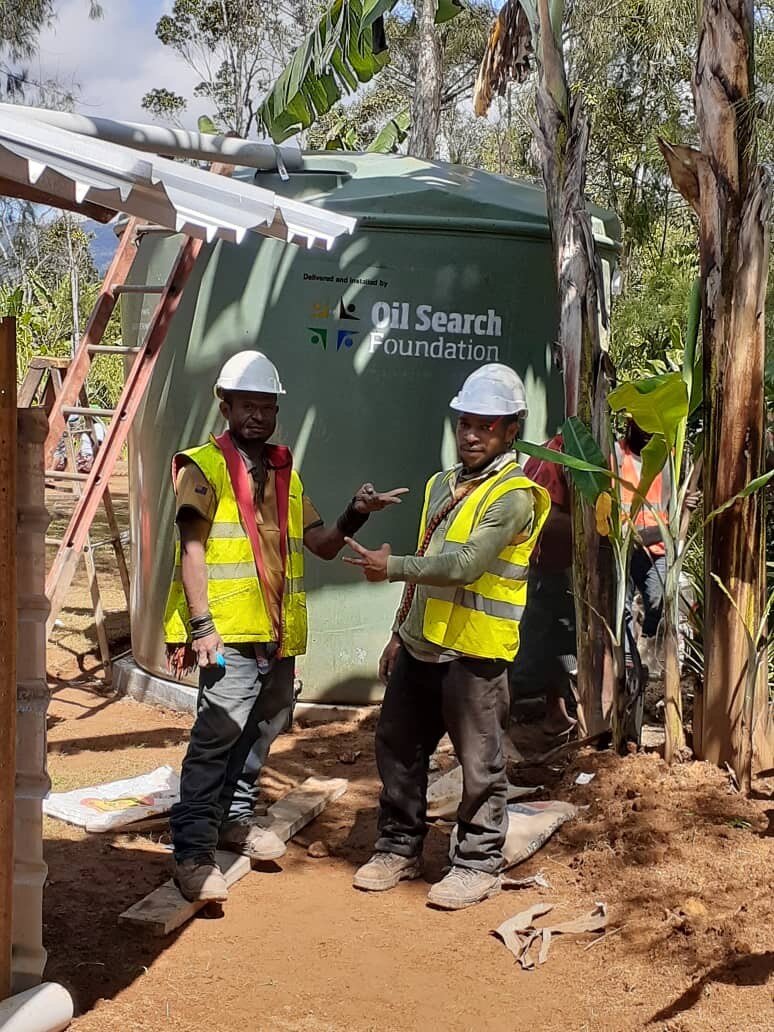 water tank installation with two men